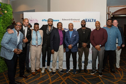 Mike Singletary (center) with retired NFL players, including Jarrett Irons and Grant Irons (far left to right).
