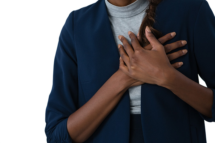 woman clutching her chest