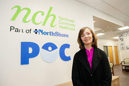 Woman in front of signage