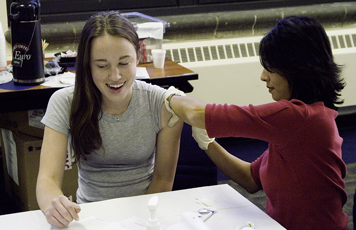 An adult getting a shot