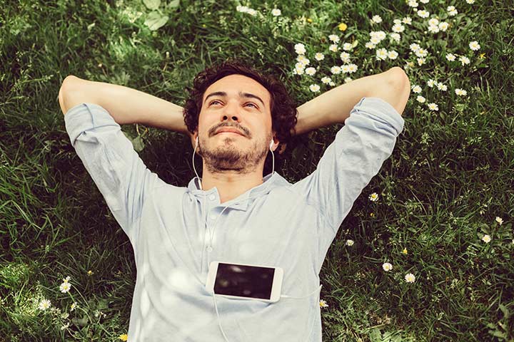 man relaxing on the grass