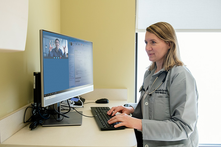 Doctor administers telehealth care