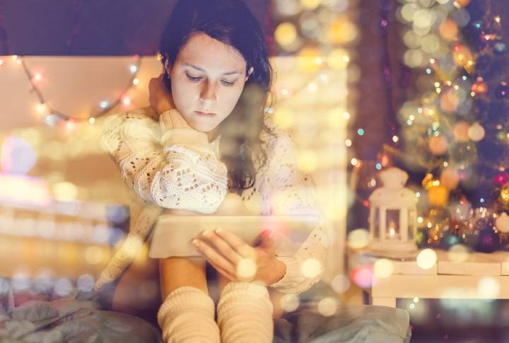 Girl using digital tablet at home