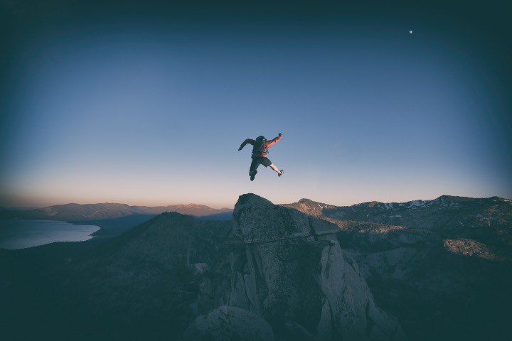 Jumping for joy over Lake Tahoe mountains