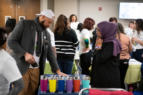 Community CARE man looking at water bottles