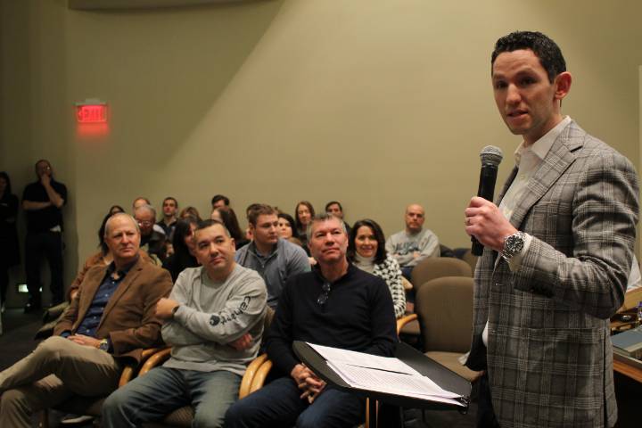 NorthShore Cardiologist Dr. Jonathan Rosenberg speaks at a ceremony honoring Steve Farber (left) Todd Siau (middle) and Jon Gault (right).