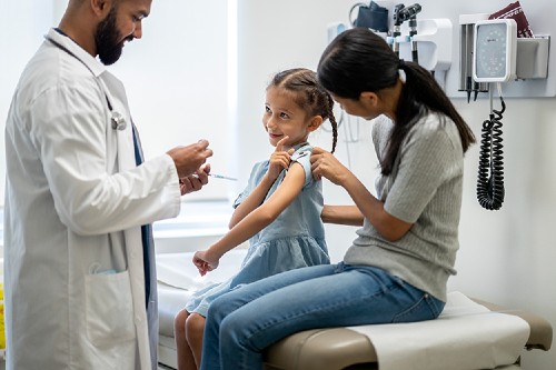 girl getting flu shot