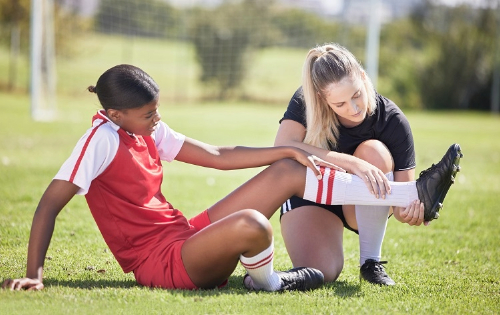 Soccer player injured on the ground