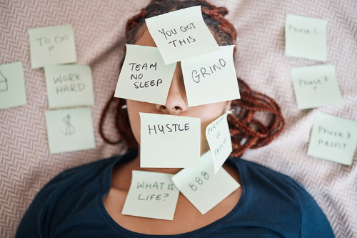 Girl lying down with post it notes