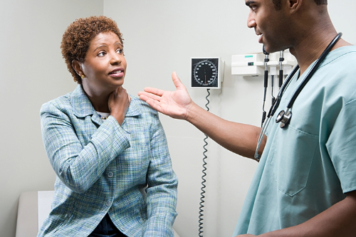 Woman speaking with doctor