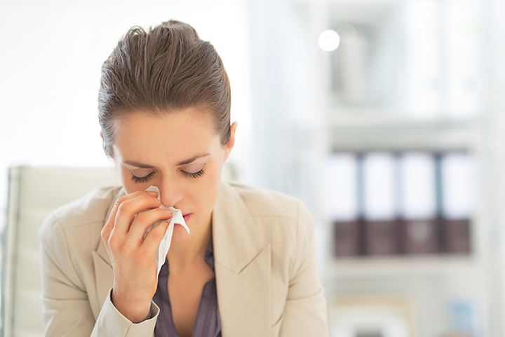 Woman Sneezing