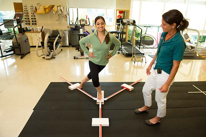 physical therapist and her patient